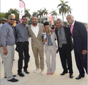 Members of the Miami Dade College (MDC) Advisory team posing with Trinidadian soca king, Machel Montano (center) during last week’s three-day convention of the – Florida Caribbean Students Association annual Leadership Conference held (Apr. 4-6) at the Miami Dade College North Campus.  From left are:- Joshua Arjona, James Pierre, Machel Montano, Suze Guillaume, and Miami attorney Marlon Hill, a founding member of the FCSA. 