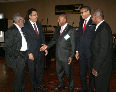 President of the National Association of Jamaican and Supportive Organizations (NAJASO), Rick Nugent (center), has the rapt attention of (l-r) NAJASO’s chairman Dr. Richard Constable, Jamaica’s Ambassador to the United States, His Excellency Stephen Vasciannie, Jamaica’s Ambassador to the United Nations, His Excellency Courtney Rattray and President of the Jamaica Association of Maryland (JAM), Noel Godfry prior to the start of NAJASO’s 37th annual banquet and awards ceremony. (Photo Credit: Derrick Scott)