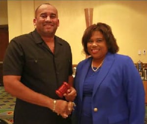 New CTO chairman, Richard Sealy, receives the gavel from his immediate predecessor, USVI commissioner of tourism, Beverly Nicholson-Doty