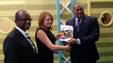 Pippa Jacks of TTG presents a copy of the European Industry Trends & Insight Report 2014 to CTO Chairman Richard Sealy with CTO SG Hugh Riley (L) looking on.