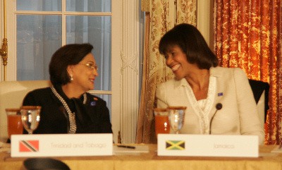 The Prime Minister of Trinidad and Tobago, the Hon. Kamla Persad Bissessar engages, Prime Minister Portia Simpson-Miller in conversation at the Caribbean Energy Security Summit held at the US State Department on Monday, January 26, 2015. (Photo credit Derrick Scott)