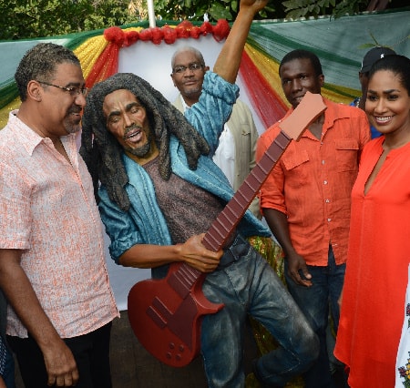 From left to right, Minister of Tourism and Entertainment, the Hon. Dr. Wykeham McNeill; Executive Director of the Tourism Enhancement Fund, Clyde Harrison; sculptor Scheed Cole; and Minister of Youth and Culture, the Hon. Lisa Hanna, pose beside the new statue of the late reggae icon, the Hon. Robert Nesta “Bob” Marley, which was unveiled Sunday (February 8) at the Trench Town Culture Yard. The statue, sculpted by Scheed Cole, was commissioned by Minister McNeill as part of a multi-million dollar renovation of the culture yard that is being funded by the Tourism Enhancement Fund (TEF).  This is in keeping with the Ministry’s drive to develop cultural heritage sites across Jamaica and further enhance and diversify the island’s tourism product.