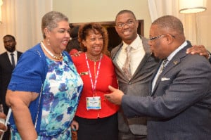 Welcome Home: “The Honourable G. Anthony Hylton, Minister of Industry, Investment and Commerce (right), The Honourable Arnaldo Brown, Minister of State in the Ministry of Foreign Affairs & Foreign Trade (second right) , Her Excellency The Honorouble Aloun Ndombet-Assamba, High Commissioner of the Jamaica High Commission in the UK, (left) and JAMPRO President, Diane Edwards (centre) have a laugh at the Jamaica Diaspora Conference’s Opening Ceremony Sunday, June 14, 2015.