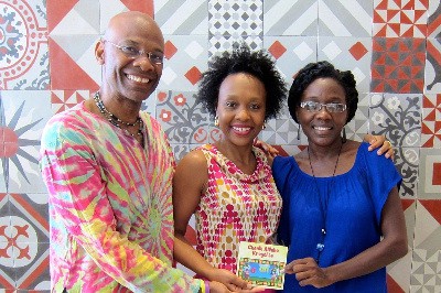 Professor Michel DeGraff, Marie Rodny Laurent and Ann Timothee Milfort Holding the newly released DVD of the kreyol alphabet 