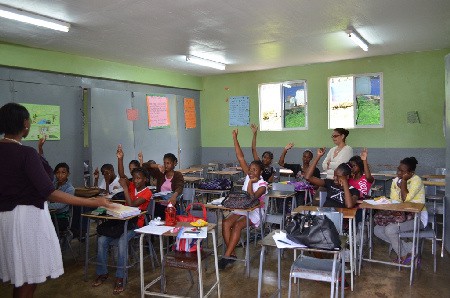 Students from the May Day and Mile Gully high schools in Manchester, Jamaica, participate in class during the 2013 TEACH Caribbean summer camp. The successful programme, supported by Rhodes Scholars, assists students from rural high schools to improve their competency in maths and English over a course of four summers. 