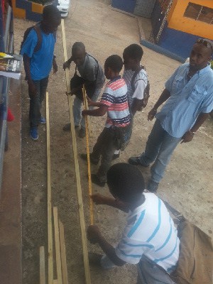 Boys from the May Day and Mile Gully high schools in Manchester, Jamaica, construct a ladder using their maths skills. The students were participating in the 2013 TEACH Caribbean summer camp. The successful programme, supported by Rhodes Scholars, assists students from rural high schools to improve their competency in maths and English over a course of four summers. 