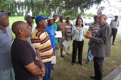 Jamaica's Minister of Labour and Social Security, the Hon. Derrick Kellier addresses farm workers on Wednesday, August 19, 2015 at M.G. Hurd Farm, Hudson Valley New York.  (Photo Credit to Derrick Scott)