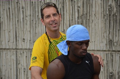 Chiropractic Physician Dr. Michael Douglas with Usain Bolt. Douglas will be with the team in Beijin, China to provide physical therapy to the Jamaican athletes in their quest for gold.