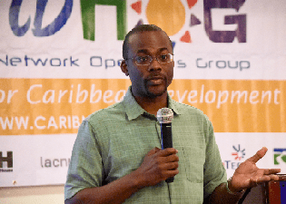 Bevil Wooding, Internet Strategist, Packet Clearing House, fields questions during an open session at CaribNOG 10, Belize City, November 2015.  Photo courtesy: CaribNOG. 