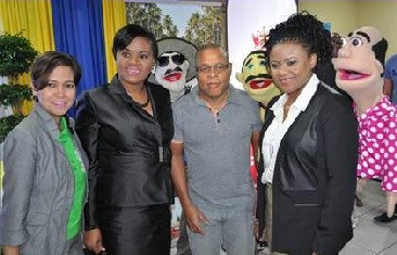 Juliana Fermin, Director, Soca on the Seas, the Honourable Shamfa Cudjoe – Minister of Tourism, Dr. the Honourable Nyan Gadsby-Dolly- Minister of Community Development, Culture and the Arts, with members of the Santana Television series.