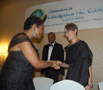 Foreign Affairs and Foreign Trade Minister, Senator Kamina Johnson Smith receives a warm welcome from USA congresswoman Yvette Clarke (L) as she arrives at the JFK Hilton hotel prior to delivering the keynote address at the North-East USA Diaspora Talawah Gala on Saturday, June 11, 2016.  At center is Asst. Deputy Director of Diaspora and Consular Affairs in the Ministry of Foreign Affairs and Foreign Trade, Mr. Lincoln Downer  (Photo credit: Derrick Scott)