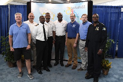 Representatives in key Government Ministries that are actively involved in safeguarding The Bahamas’ citizens, visitors and property in cases of weather conditions or disasters along with NOAA  representatives.  From left to right are: Gregory F. Romano, Director of Communications, National Weather Service; Clinton Wallace, Deputy Director, Aviation Weather Center (AWC); Trevor Rolle, Sr. Customs Officer; Bradley Strachan, commercial pilot, Department of Civil Aviation; Greg Rolle, pilot and Sr. Director Sales, Marketing & Sports, Bahamas Ministry of Tourism; Mike Bettwy, AWC Warning Coordination Meteorologist; Ed Molicky, NOAA Representative for the International Federal Partnership and Dennis Rolle, pilot and superintendent, Royal Bahamas Police Force  Photo credit:  Larry Grace Photography 