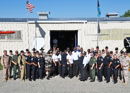 Members of The Bahamas and US Agencies pose together in front of The Pavillion