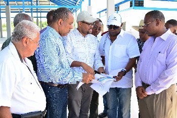 Looking over plans for the town of Falmouth market are (from left) Senior Director, Government Relations with the PAJ, Dr. Paul Robertson, President of the PAJ, Prof. Gordon Shirley; PAJ Architect Brian Bernal; Minister Bartlett and Mayor of Falmouth, Councillor Garth Wilkinson. 