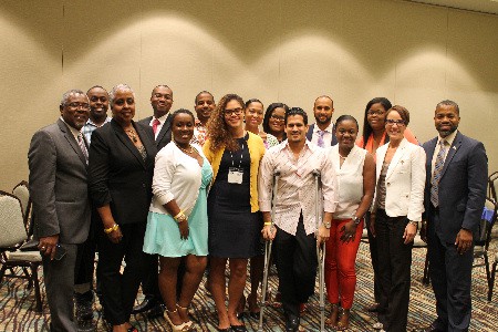 Millennials of Jamaican descent (first and second generation) posing with the officials at the recent Diaspora Summit and Gala in Orlando (June 24-26).  L-R:  Jamaica Diaspora Advisory Board Member for the Southern United States, Wayne C. Golding, Sr.. Esq., and Ambassador Sharon Saunders (second left) Director of Diaspora Affairs in the Ministry of Foreign Affairs and Foreign Trade, Kingston.  To the extreme right are Senator the Hon. Kamina Johnson Smith ( second right front row) who was keynote speaker, and Jamaica’s Consul General, Franz Hall (right front).   