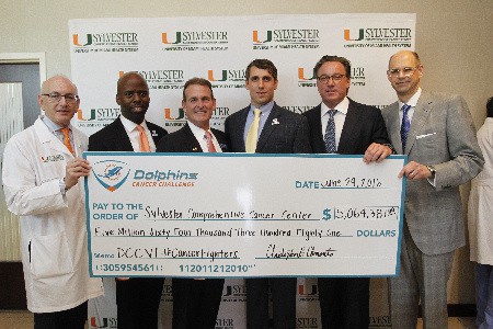 Miami Dolphins present $5 million check to Sylvester Comprehensive Cancer Center (L-R) Sylvester Comprehensive Cancer Center Director Dr. Stephen D. Nimer, Miami Dolphins Senior Vice President of Communications & Community Affairs Jason Jenkins, Lennar Homes CEO Stuart Miller, Dolphins Cancer Challenge CEO Michael Mandich, DCC VII Chair Eric Feder and Sylvester Board of Governors Chair Adam Carlin  Dolphins Cancer Challenge VI 