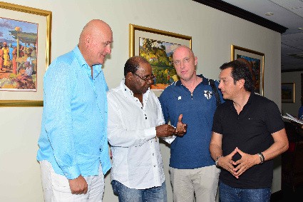 An upbeat Minister of Tourism, Hon. Edmund Bartlett (2nd left) is animated as he expresses how pleased he is to hear that the US$900 million mega multiple-hotel development that Karisma Hotels & Resorts will roll out in Llandovery in St. Ann is ready as they are set to break ground in January 2017 for the first three hotels. Under the ‘Sugar Cane Project’, Karisma plans to build 10 hotels over 10 years, with a total of 5,000 rooms. Direct employment will be created for 10,000 Jamaicans. With Minister Bartlett are (from left) Executive Vice President, Karisma Hotels & Resorts, Lubo Krstajic; Neil Evans, Chief Operating Officer, Karisma Hotels & Resorts and Vice President, Corporate Affairs and Business Development, Ruben Becerra. 
