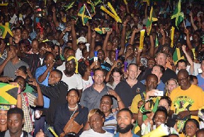 Jamaicans and visitors alike crowd the streets of Kingston, Jamaica to cheer on “Lightning” Bolt during the 100m final on Sunday, August 14.