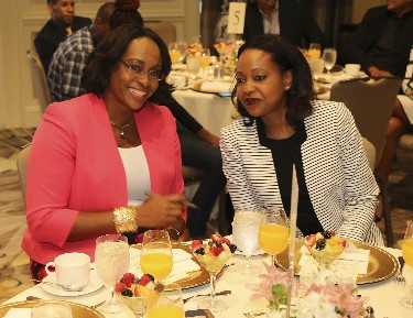 Mrs Juliet Holness, wife of Jamaica’s Prime Minister (left) shares a light moment with president of the Benevolent Mission of Atlanta BMA, Mrs Gail Dunwell at a special breakfast given in her honour during her recent trip to Atlanta by BMA. Photo by Derrick Scott 