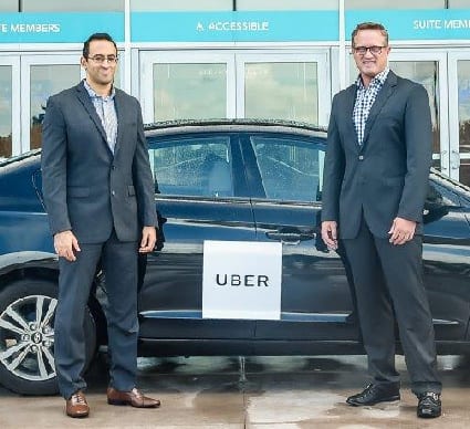(L-R) Uber South Florida General Manager Kasra Moshkani with Dolphins President CEO Tom Garfinkel welcome Uber to Hard Rock Stadium (3)