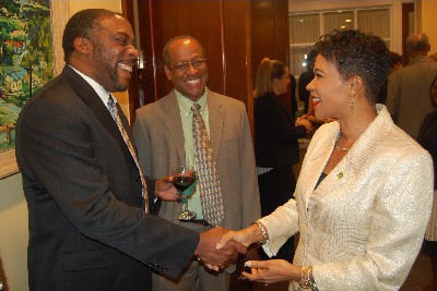 Jamaica’s Ambassador Designate to the United States, Her Excellency Audrey Marks receives a warm greeting from Morgan State University Professor, Dr. Joseph Whittaker at a reception given by the Embassy of Jamaica in honor of Minister of Foreign Affairs and Foreign Trade, Senator Kamina Johnson-Smith at the Embassy of Jamaica on Friday, September 16, 2016.  Looking on is NASA engineer Paul Earl. Photo by Derrick Scott