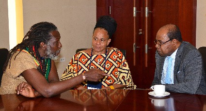 Minister of Tourism, Hon. Edmund Bartlett (right) meets with Edi Wray, First Man and Head of the Rastafari Indigenous Village at Irwin in Montego Bay following the minister’s opening address at Canex Jamaica, held from September 2 - 3 at the Montego Bay Convention Centre. Listening attentively is Mitzie Williams (centre). Canex Jamaica is the first cannabis-centred conference on the business potential of the marijuana trade.