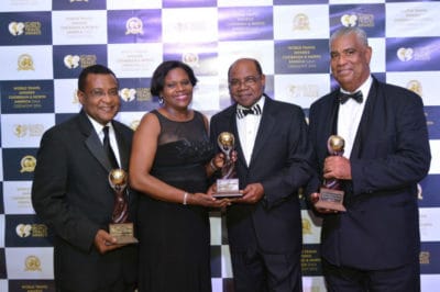 Minister of Tourism, Hon. Edmund Bartlett (2ND right) is captured in a celebratory mood with (from left) Director of Tourism, Paul Pennicook; Permanent Secretary in the Ministry of Tourism, Jennifer Griffith and Chairman of the Jamaica Tourist Board (JTB), John Lynch. 