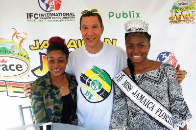 Double Olympic Champion, Elaine Thompson (left) with International Freight Consolidators CEO John Collins and Miss Jamaica Florida Teen Shanna Francis at the Grace Jamaican Jerk Festival