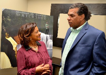 Jamaica’s honorary Consul to Georgia, Mrs. Jewel Scott, congratulates Jack Radics at the launch of his new album, “The Watershed”