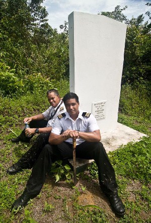 Capt. Gerry Gouveia and his son Gerry Jnr. at the Monument to victims of the Jonestown tragedy in Guyana's Northwest District.