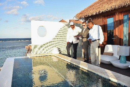 Edmund Bartlett, Adam Stewart, Paul Pennicook at Sandals Royal Caribbean’s uniquely created over-water suites in Jamaica
