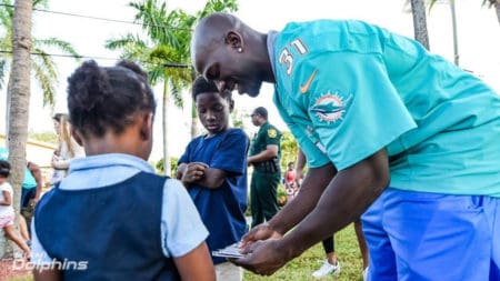 Michael Thomas passing out NFL trading cards by Panini America with Broward Sheriff's Office