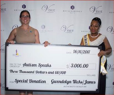 Miss Dream Castle Pageant Founder & Chief Executive Gwendolyn Nicks-James (right) presents check to Jena Schneider, Senior Director of Field Development at Autism Speaks