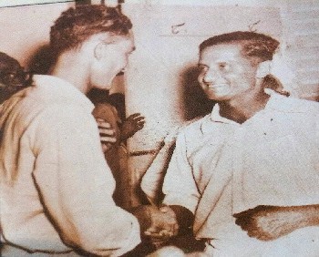 Rival captains Jeff Stollmeyer (West Indies) & Vijay Hazare (India) congratulate each other before cutting the joint birthday cake at Bourda Oval on March 11, 1953