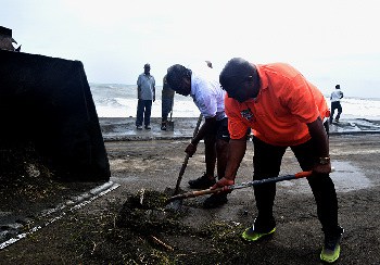 St. Kitts and Nevis PM Harris and Minister Liburd assist in post-Hurricane Maria clean up.