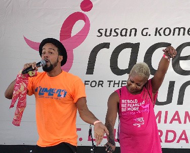 KES on the Main Stage with Team DLIMERS captain, Carla Hill at the Komen Race For Cure in Miami