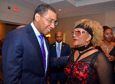 Prime Minister of Jamaica, Andrew Holness and reggae songbird, Marcia Griffiths