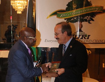 Congressman Eliot Engle, accepts the FURI Pinnacle Award from founder of CaribNews, Dr. Carl Rodney 