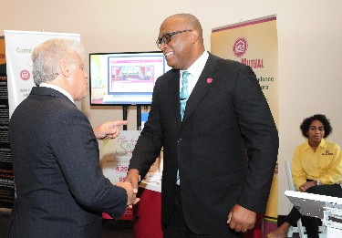 Christopher Denny, Vice President, Service and Sales Support , Victoria Mutual Building Society and Howard Berger, at Jamaica USA Chamber of Commerce Biz Expo