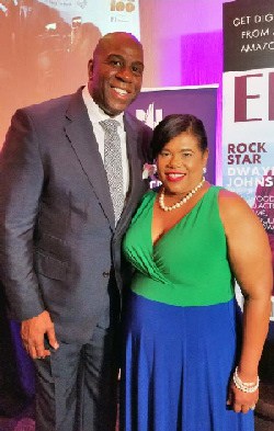 Commissioner Beverly Nicholson-Doty with basketball legend Earvin "Magic" Johnson 