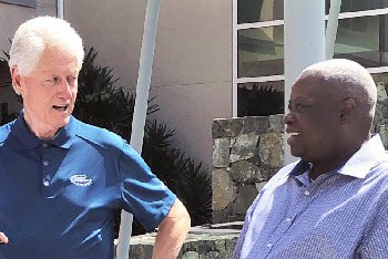 Former United States President Bill Clinton (left) meets with Governor Kenneth Mapp on Monday in the U.S. Virgin Islands