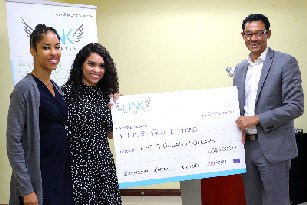 Yamel Marshall and Janay Pyfrom-Symonette from Findrpro receiving cheque from Chris McNair of LINK-Caribbean