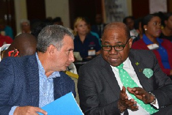 Metry Seaga and Edmund Bartlett discuss investment in tourism supplies for Jamaica