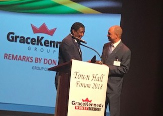 GraceKennedy CEO receives Key to Broward County from Broward County Commissioner Dale V. C. Holness