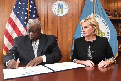 Governor Mapp and HUD Deputy Secretary Pamela Patenaude sign off on the final paperwork granting the Virgin Islands $243 in recovery funds.
