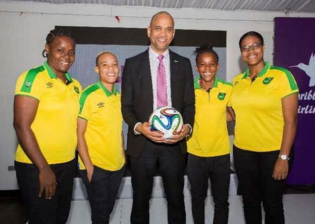 Caribbean Airlines CEO, Garvin Medera and members of the Senior Reggae Girlz football team.