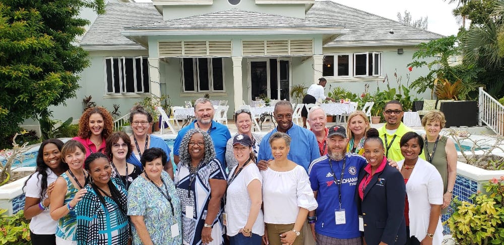 Travel Agents enjoy People-to-People Experience at home of a Bahamian in Nassau - Host Mr. Henry Lightbourne in blue shirt second row 5th from right (2).jpg