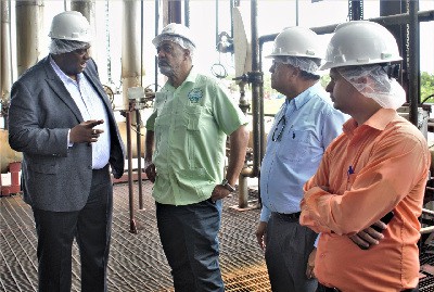 EPA Director Dr Vincent Adams makes a point to DDL Chairman Komal Samaroo and his team during the visit to DDL operations at Diamond.