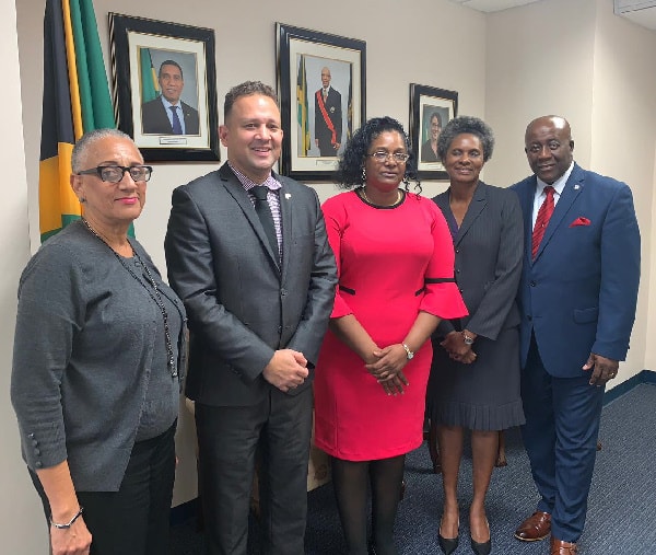 Jamaica’s Consul General to Miami, Hon. Oliver Mair (second left) and staffers Cheryl Wynter (left), Deputy General Consul Sharon Burrell (second right) and Consul Vance Carter (right), were happy to welcome Rev. Dr. Caretta Mathie,(third right) during a recent courtesy call, at Jamaica’s Consulate in Miami