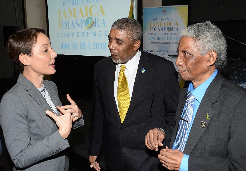 Leon Mitchell (centre), Assistant Manager The Jamaica National Group, listens as Senator Kamina Johnson-Smith (left) Minister of Foreign Affairs and Foreign Trade makes a point at the launch of the Diaspora Conference, recently. Also participating in the discussion was Professor Neville Ying, Chair of the Jamaica Diaspora Conference Programme and Sub-Committee, Pro Chancellor, The Mico University.